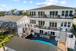 an aerial view of a house with a swimming pool at Fair Winds West in Cape Carteret
