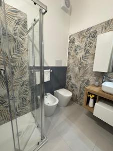 a bathroom with a shower and a toilet and a sink at Sasi Home in Terrasini