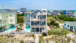 an aerial view of a house with a pool at Sea Worthy in Indian Beach