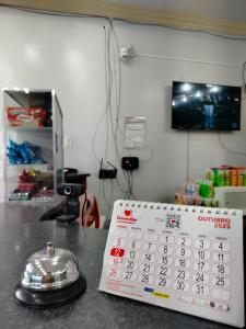 a calendar sitting on top of a counter next to a table at Hotel Macapá in Macapá +22 photos