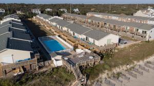 an aerial view of a row of houses and a swimming pool at Pine Knoll Townes 126 by Emerald Isle Realty in Pine Knoll Shores
