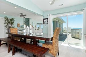 a dining room with a table and chairs at All About Bubbles in Indian Beach