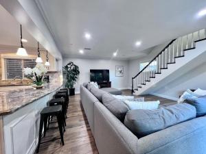 a living room with a couch and a bar at Destination #28 in Anaheim