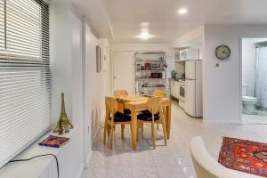 a kitchen and dining room with a table and chairs at Easy NYC Commute Guttenberg Getaway Near Parks in Guttenberg