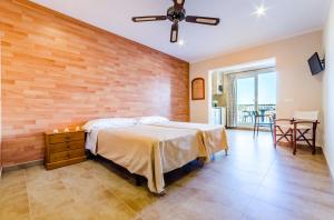 Ένα ή περισσότερα κρεβάτια σε δωμάτιο στο Apartamentos Blancala