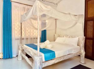 Giường trong phòng chung tại Noorè Diani