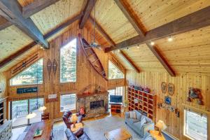 a large living room with wooden walls and ceilings at Game Room and Views Cabin Near Purgatory Resort! in Durango Mountain Resort