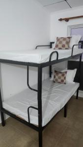 a couple of bunk beds in a room at Sapphire Homestay in Dehiwala +3 photos