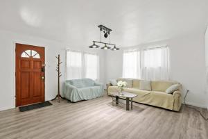 a living room with a couch and a table at 2BR Pet-Friendly Home # RV FREE in Upland