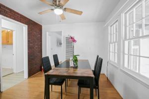 a dining room with a table and chairs and a ceiling fan at 2BR Pet-Friendly Home # RV FREE in Upland +7 photos