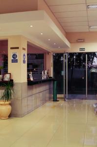an entrance to a building with a lobby with a counter at Cuesta de Miranda 2 in Villa Unión