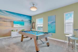 a room with a pool table in it at 475 Strand Dr in Melbourne Beach