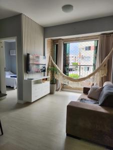 Et opholdsområde på Apartamento de 2 quartos Completo