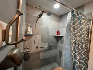 a shower with a shower curtain in a bathroom at Tijuana Stay 1832 in Tijuana +14 photos