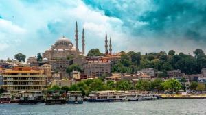 a view of a city from the water with boats at VALENCE HOTEL Taksim in Istanbul