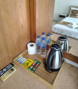 Postel nebo postele na pokoji v ubytování Amai Pancakery and Residence