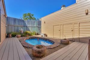 a backyard with a small swimming pool in a yard at Expansive Ocean-View Retreat with Home Theatre & Spa in Bodega Bay