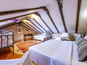 a bedroom with a large white bed in a room at House with Two Bedrooms Dinko HH in Višnjica