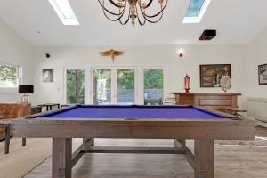 a large living room with a pool table at Stylish 3BR Retreat Close to Coast & Wineries in Occidental
