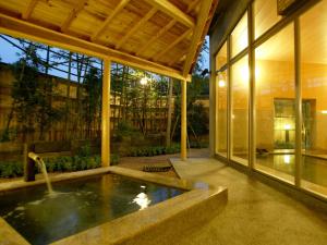 a swimming pool in the middle of a house at 萩八景 雁嶋別荘 in Hagi