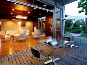 a patio with a table and chairs on a deck at 萩八景 雁嶋別荘 in Hagi +30 photos