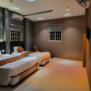 Ένα ή περισσότερα κρεβάτια σε δωμάτιο στο NP Luxury Motel