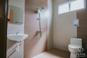 a bathroom with a toilet and a sink at Ipoh Gateway by Verve 4R4B - 14 Pax in Ipoh +20 photos