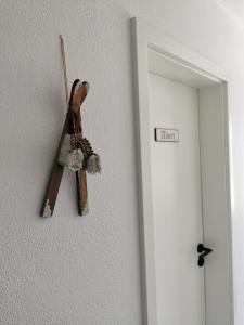 a peace sign hanging on a wall next to a door at Chalet Bambi in Blaibach