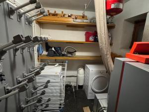 a kitchen with a bunch of knives in a room at Chalet à Méribel avec service de conciergerie et animaux admis - FR-1-613-143 in Méribel