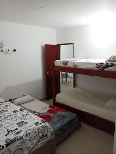 Postel nebo postele na pokoji v ubytování Los primos