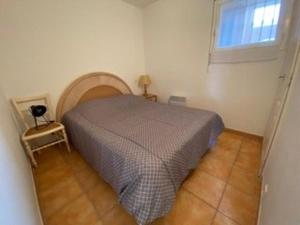 a bedroom with a bed and a window at Appartement 3 pièces avec climatisation dans résidence avec piscines et tennis - FR-1-100-364 in Cavalaire-sur-Mer