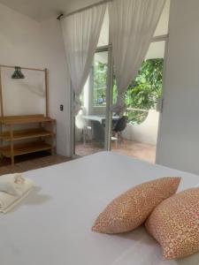 En eller flere senge i et værelse på Casa del Alma