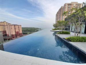 a large swimming pool with a view of a river at Urban Suites, Georgetown Penang - Near USM, Lam Wah EE in George Town