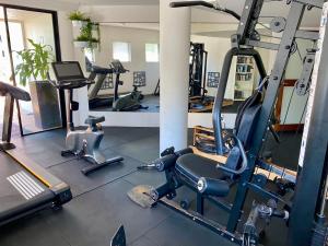 a gym with several tread machines in a room at Mooloolaba Magic at Beachclub Mooloolaba in Mooloolaba