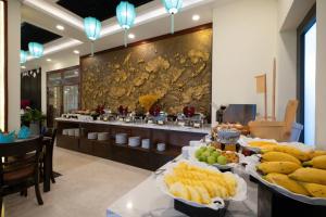 a buffet line with many different types of food on display at My Son Boutique Hotel & Spa Hoi An in Hoi An