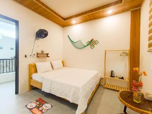 Postel nebo postele na pokoji v ubytování Làng Suối Homestay Vĩnh Hy