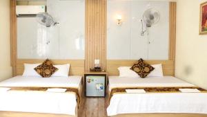 Ένα ή περισσότερα κρεβάτια σε δωμάτιο στο Văn Phượng Hostel