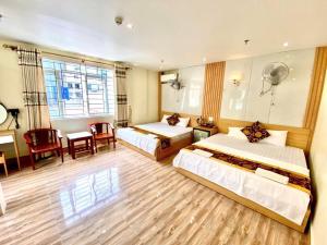 Ένα ή περισσότερα κρεβάτια σε δωμάτιο στο Văn Phượng Hostel