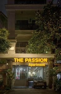 a building with a sign that reads the passion appointment at The Passion Hotel Airport in Ho Chi Minh City