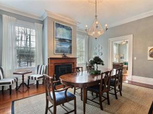 a dining room with a table and chairs at Mint Julep Estate in Savannah