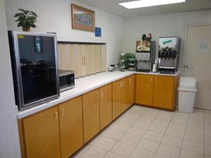 a room with a large counter with aperature at Americas Best Value Inn Kinston in Kinston