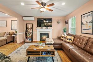 a living room with a couch and a fireplace at Lakeview Retreat w Kayaks Game Room Firepits Gated Community w Lake Beach Access in East Stroudsburg