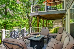 a porch with chairs and a deck with a balcony at Lakeview Retreat w Kayaks Game Room Firepits Gated Community w Lake Beach Access in East Stroudsburg