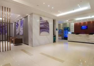 a lobby of a building with a lobby at City Comfort Inn Liuzhou High-speed Railway Station in Liuzhou