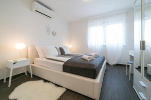 Postel nebo postele na pokoji v ubytování Villa Pjena + 29 fotografií