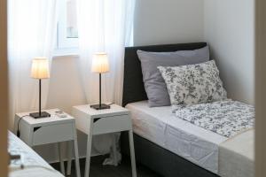 Postel nebo postele na pokoji v ubytování Villa Pjena