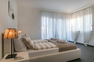 Postel nebo postele na pokoji v ubytování Villa Pjena