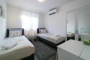 Postel nebo postele na pokoji v ubytování Villa Pjena