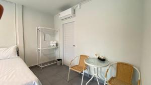 A bed or beds in a room at บ้านพรธรณีรีสอร์ทเขาใหญ่บ้านสไตล์โมเดิร์น-Baan Ponthoranee Resort Khao Yai