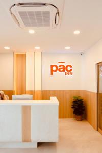 an office lobby with a pao sign on the wall at PACINN Narathiwat โรงแรมพักอินน์ นราธิวาส in Kampong Botong